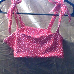 Red with white polka dots bikini top.